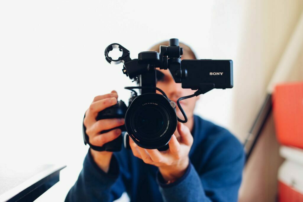 Man using a camera to create videos