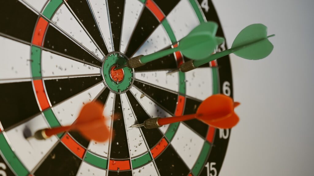 Dartboard with four darts thrown